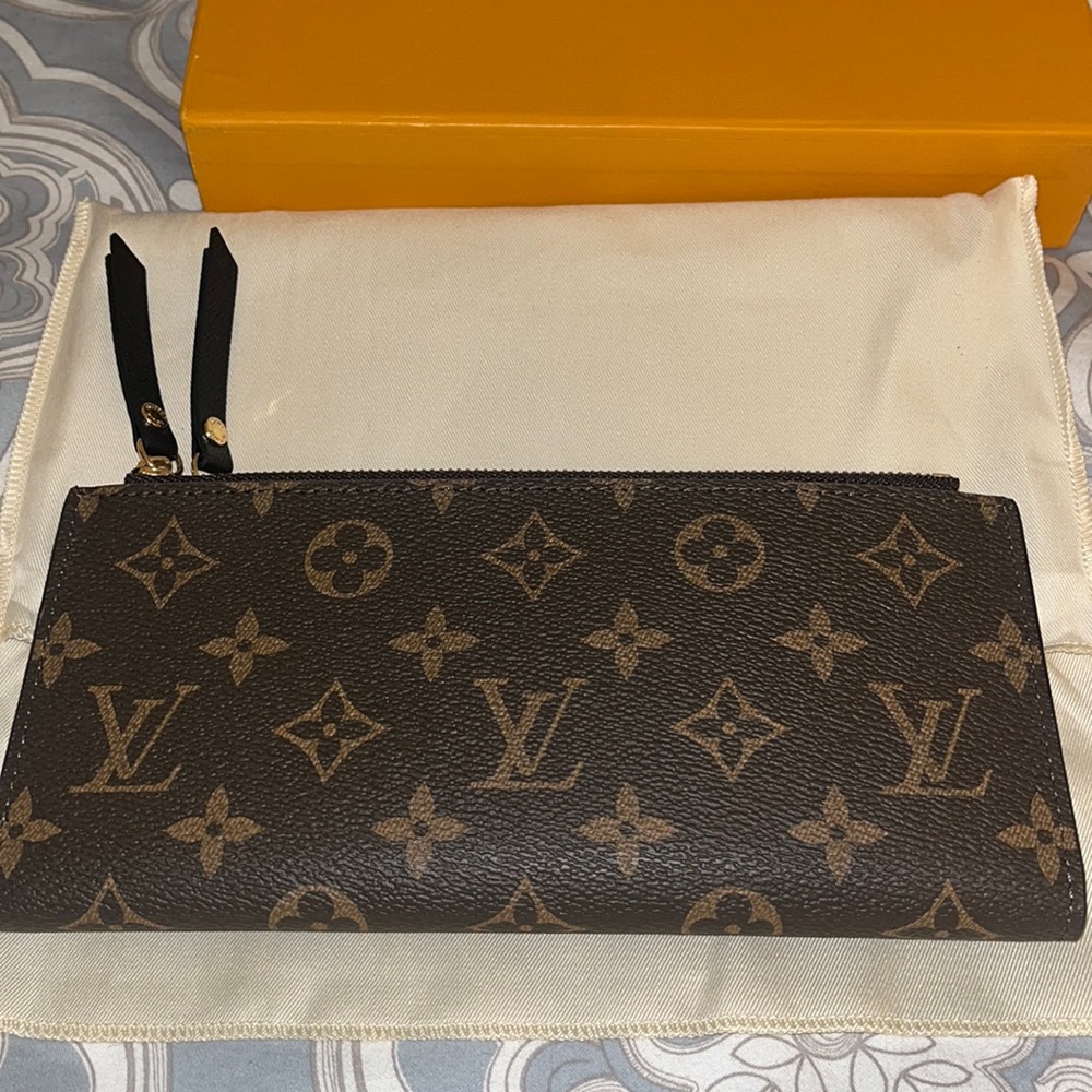 Brown and tan monogram wallet with gold trim